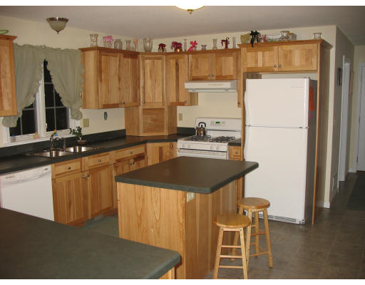 178 Upper Hampden Road Monson, MA 01057 - Photo 8 of 18 a kitchen with a sink refrigerator and cabinets