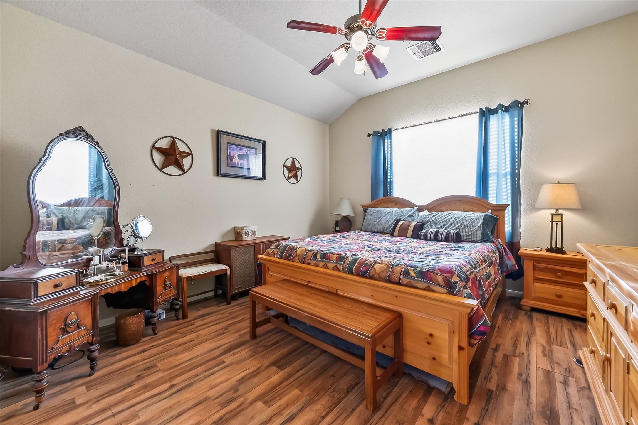22454 Toronado Ridge Lane Porter, TX 77365 - Photo 22 of 33 This cozy bedroom features warm wood flooring and ample natural light.