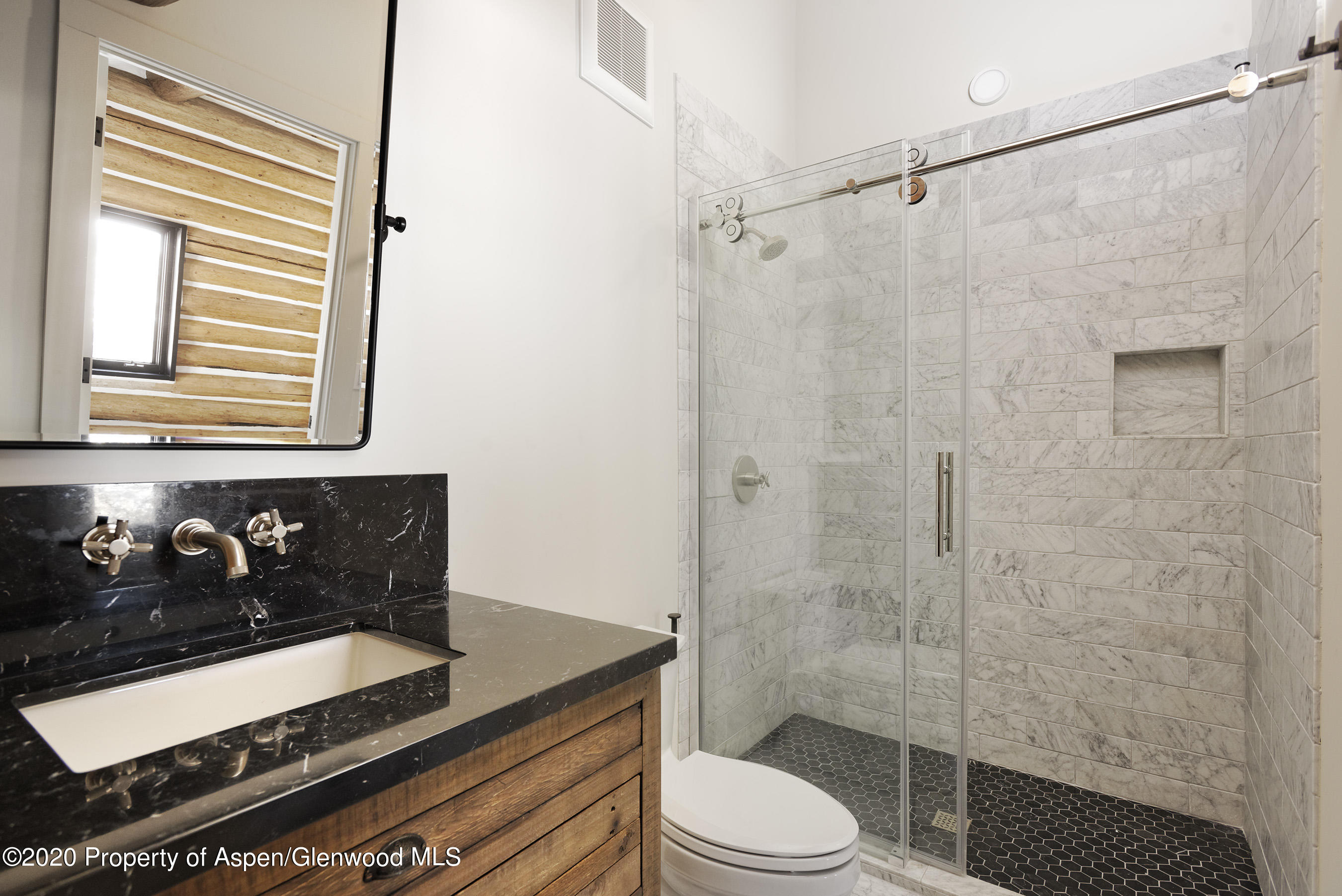844 Hillcrest Drive Basalt, CO 81621 - Photo 12 of 27 a bathroom with a granite countertop sink a toilet and shower