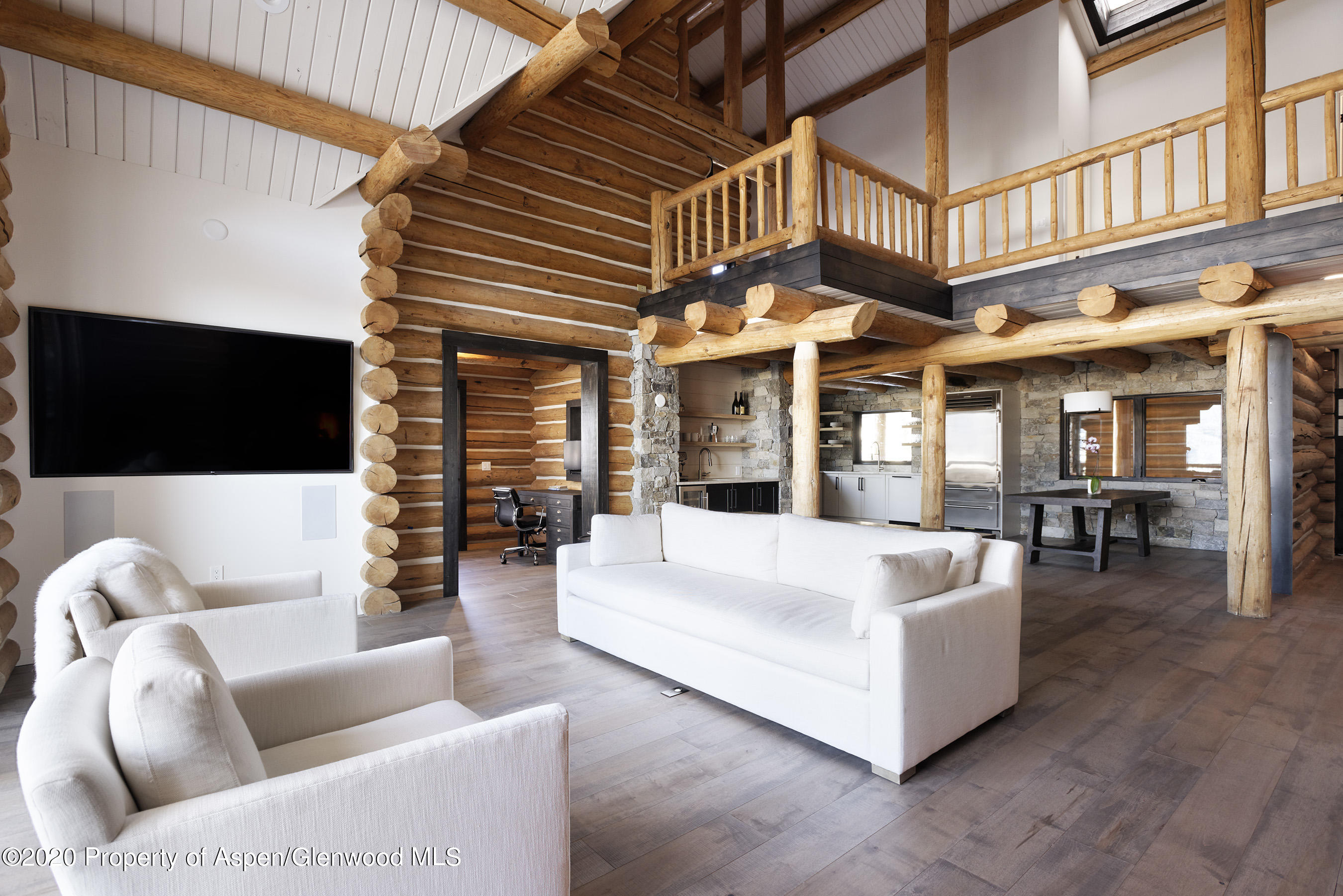 844 Hillcrest Drive Basalt, CO 81621 - Photo 16 of 27 a view of a patio with couches table and chairs with wooden floor