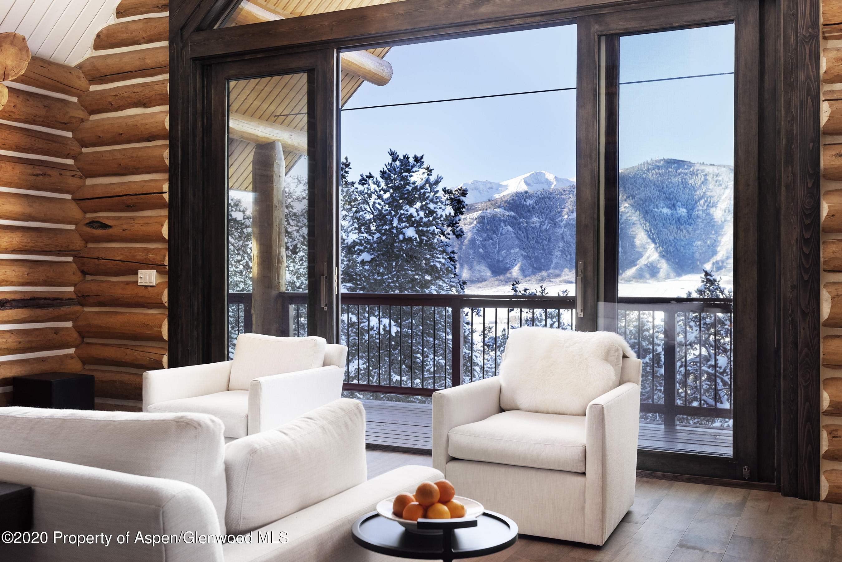 844 Hillcrest Drive Basalt, CO 81621 - Photo 2 of 27 a living room with furniture and a large window