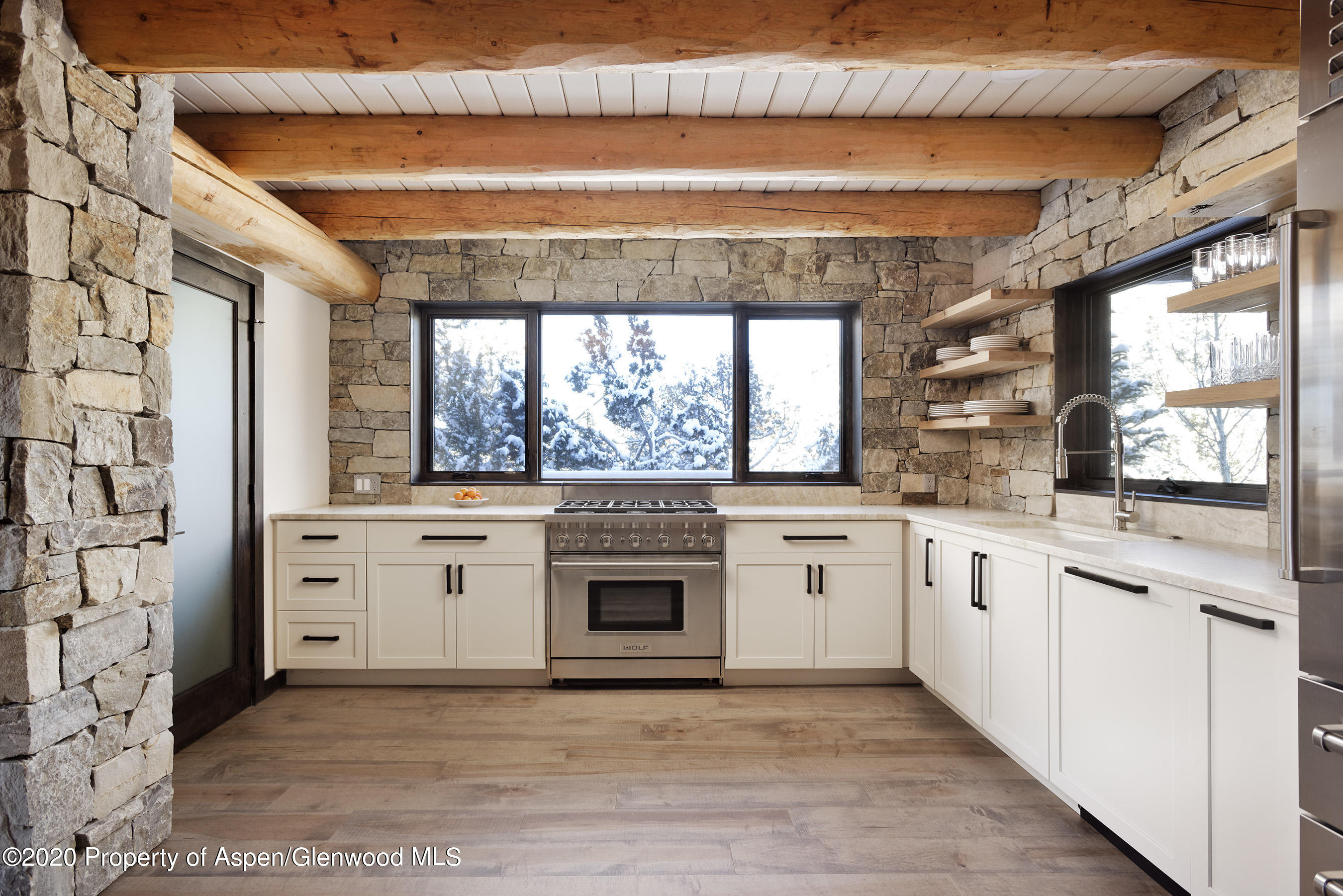844 Hillcrest Drive Basalt, CO 81621 - Photo 4 of 27 a white kitchen with a stove top oven and sink