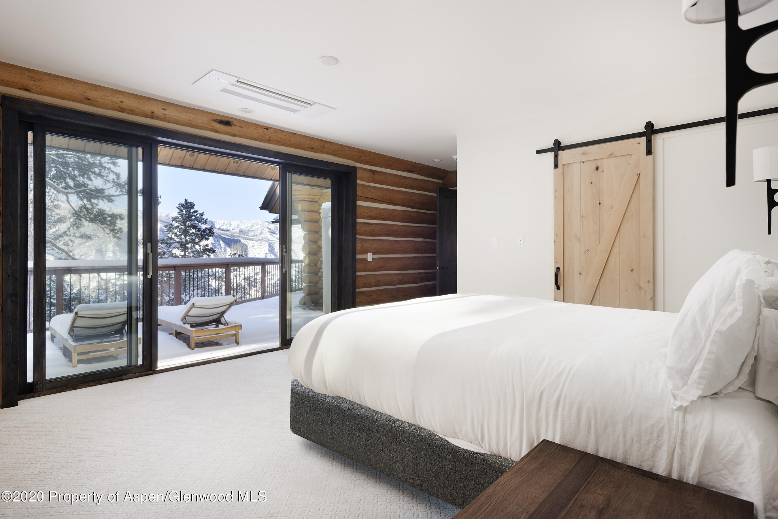 844 Hillcrest Drive Basalt, CO 81621 - Photo 8 of 27 a bedroom with a bed and a large window