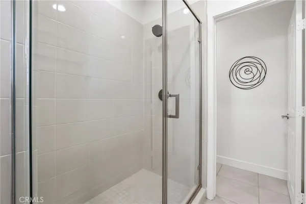 a bedroom with bed and a window