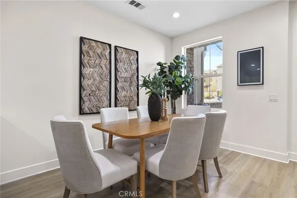 a dining room with furniture and window