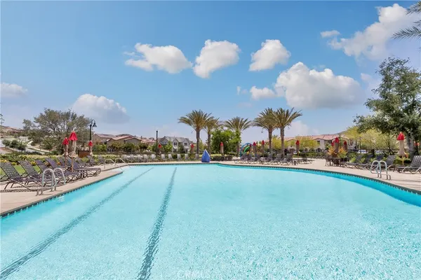 a sign board with wooden house