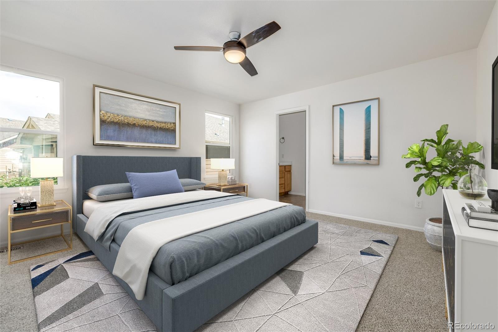 2188 Grain Bin Windsor, CO 80550 - Photo 11 of 30 a bedroom with a bed lamp and a potted plant