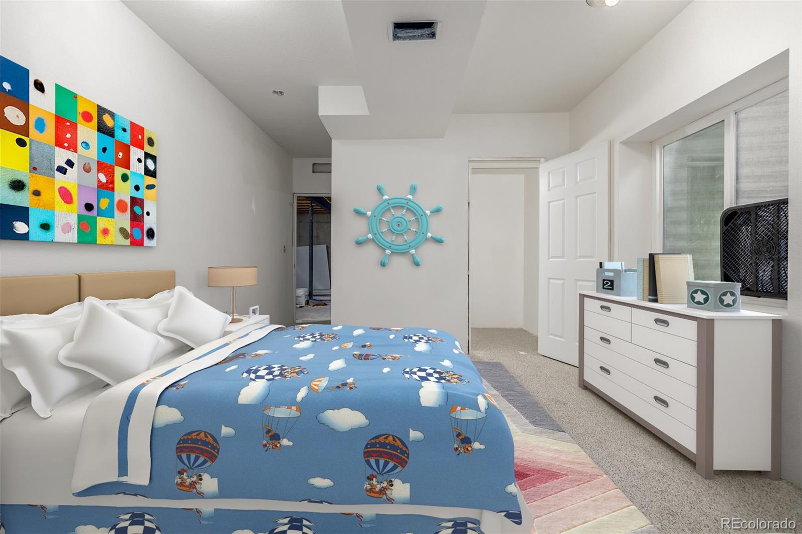 2188 Grain Bin Windsor, CO 80550 - Photo 20 of 30 a bedroom with a bed and a dresser in it