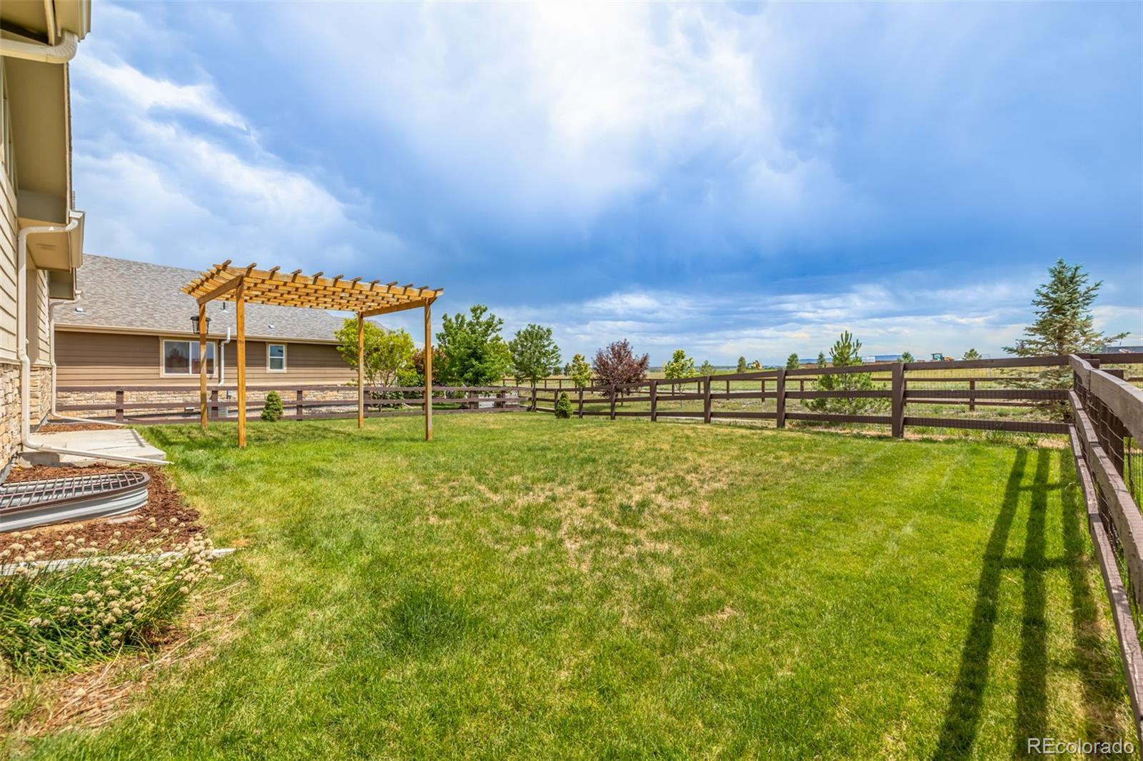2188 Grain Bin Windsor, CO 80550 - Photo 23 of 30 a view of swimming pool is middle and garden