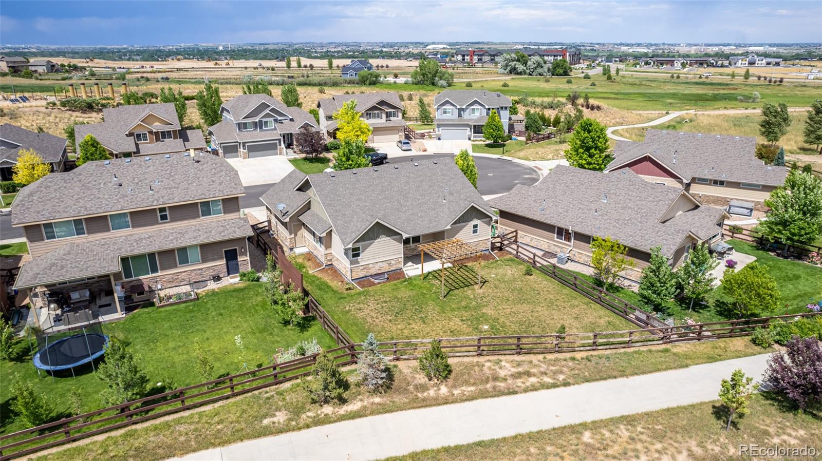 2188 Grain Bin Windsor, CO 80550 - Photo 28 of 30 an aerial view of a house with a garden and lake view