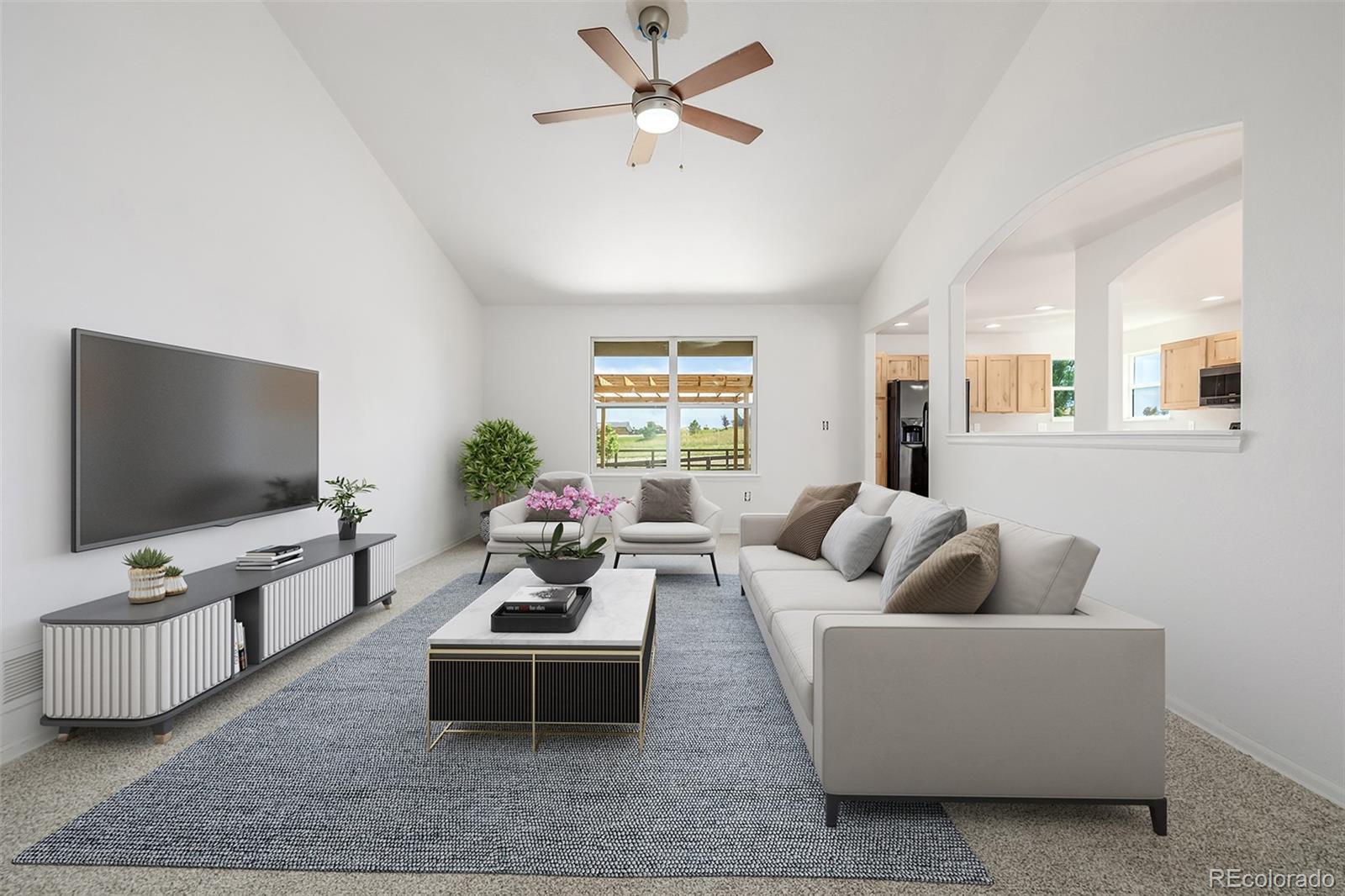 2188 Grain Bin Windsor, CO 80550 - Photo 4 of 30 a living room with furniture and a flat screen tv