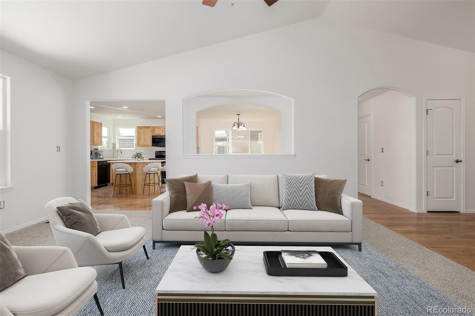 2188 Grain Bin Windsor, CO 80550 - Photo 5 of 30 a living room with furniture and a table