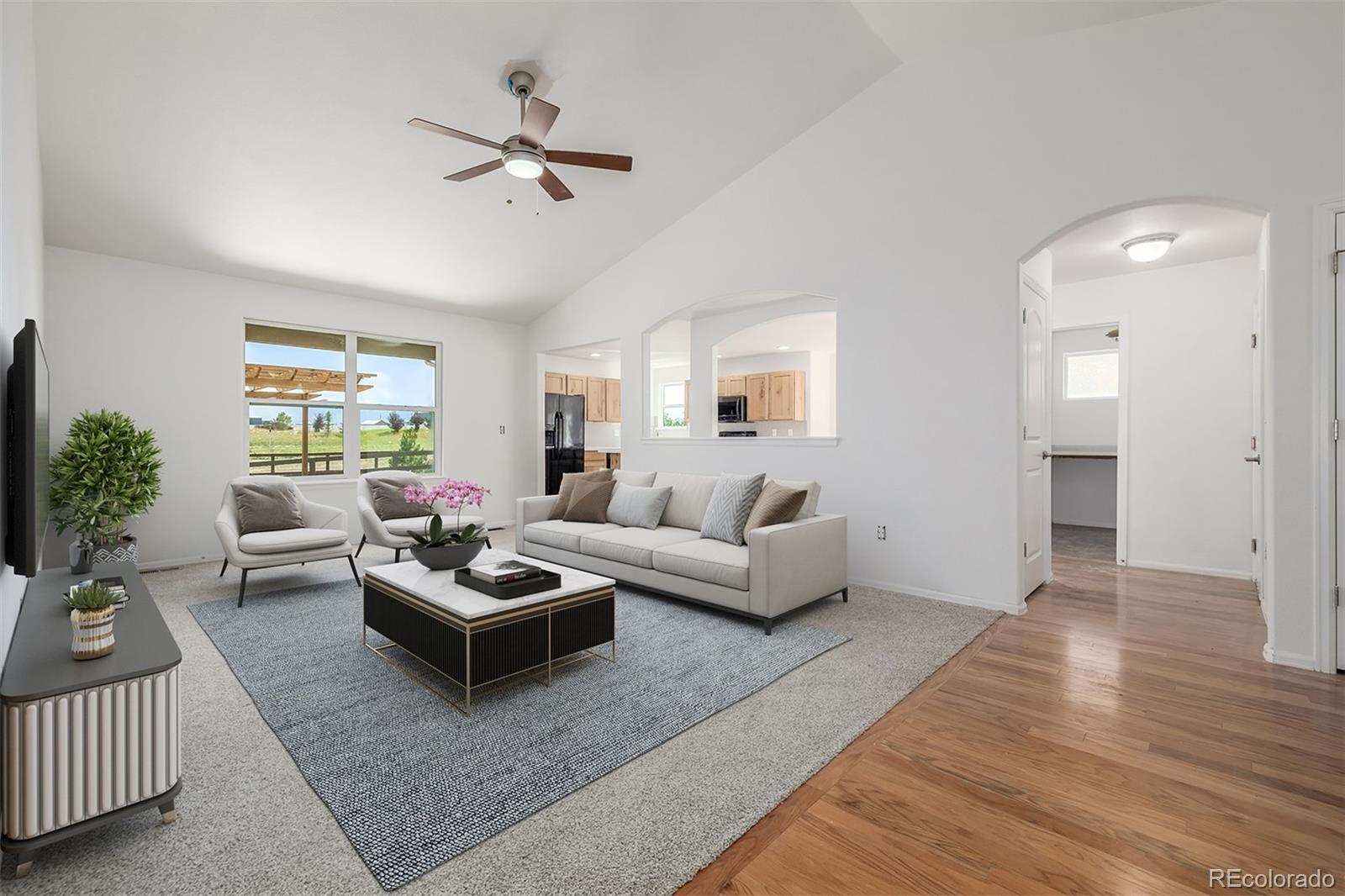 2188 Grain Bin Windsor, CO 80550 - Photo 10 of 30 a living room with furniture rug and window