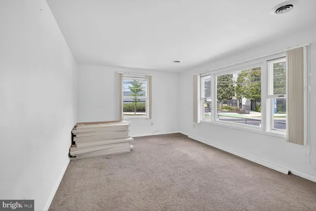 an empty room with windows