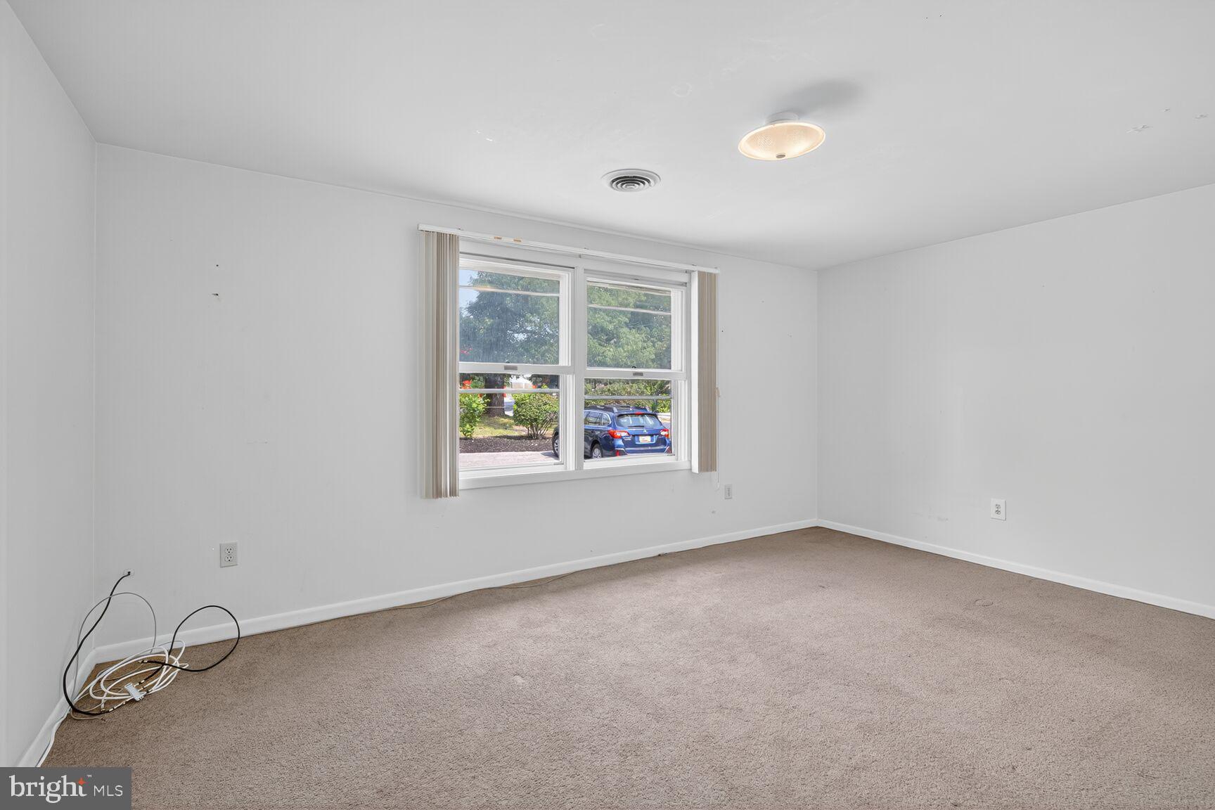 816 Islington Street Silver Spring, MD 20910 - Photo 5 of 18 an empty room with a window