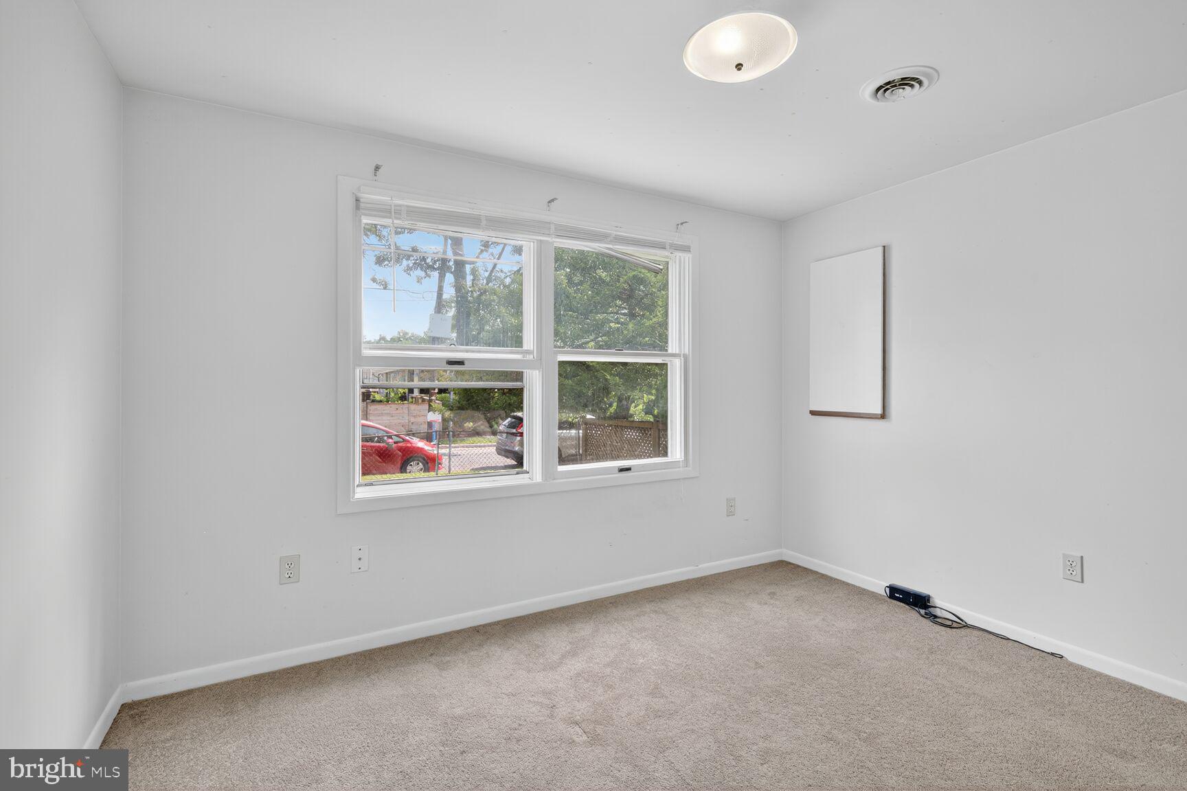 816 Islington Street Silver Spring, MD 20910 - Photo 7 of 18 an empty room with a window