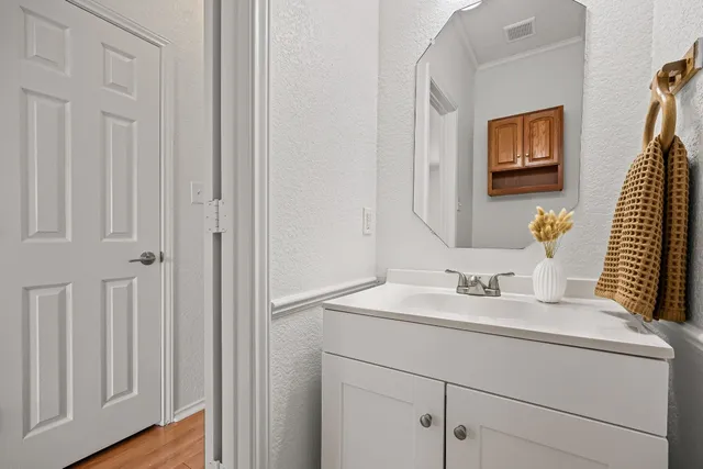 an empty room with a window and a ceiling fan