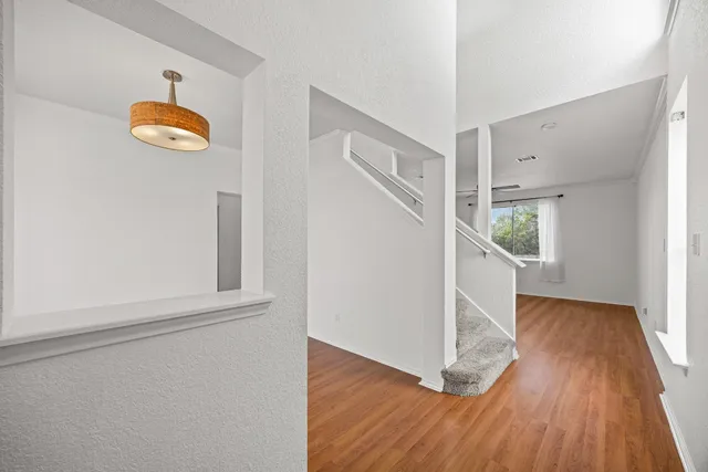 a view of an entryway with wooden floor