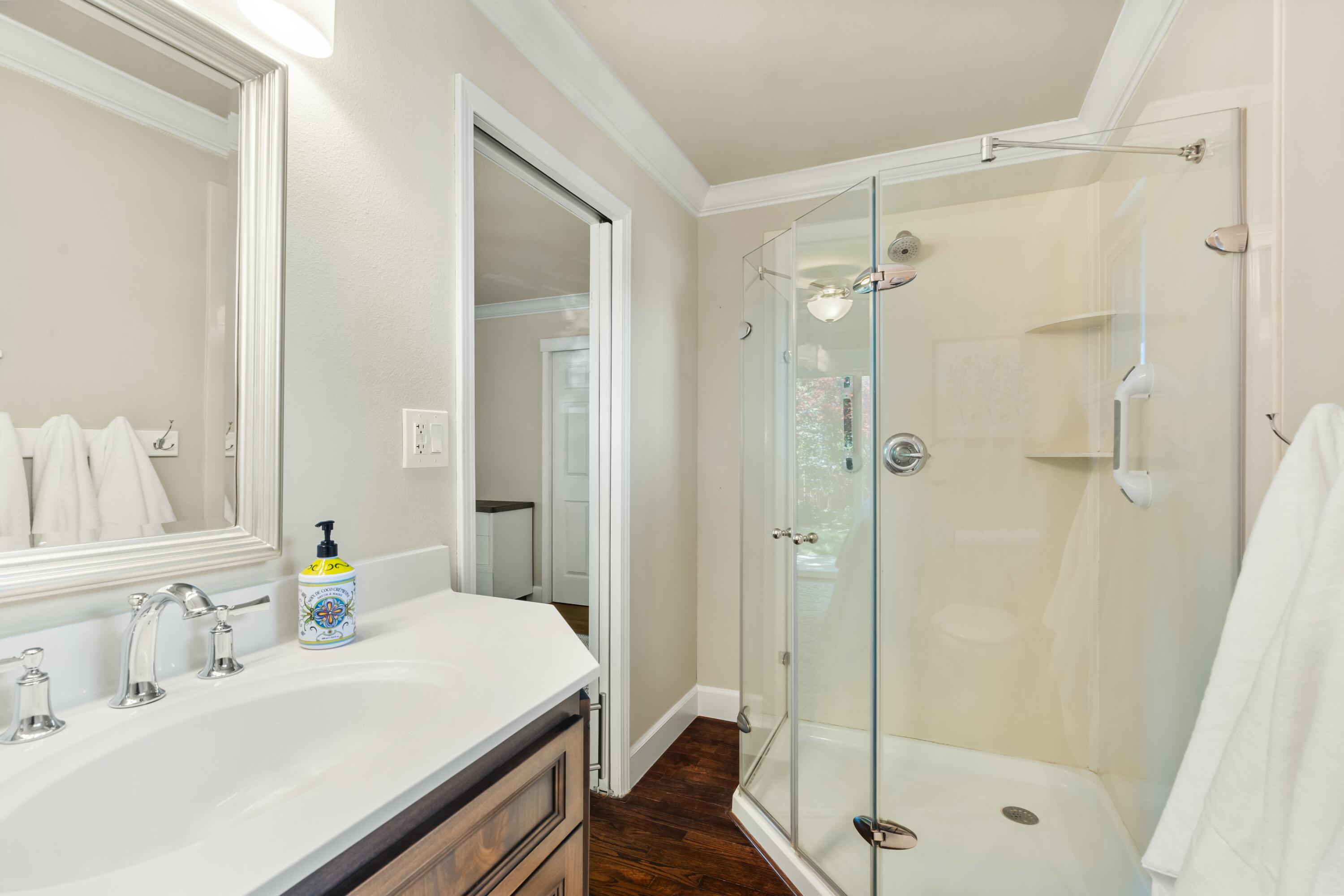 6860 Riata Drive Redding, CA 96002 - Photo 11 of 39 a bathroom with a sink shower and a mirror