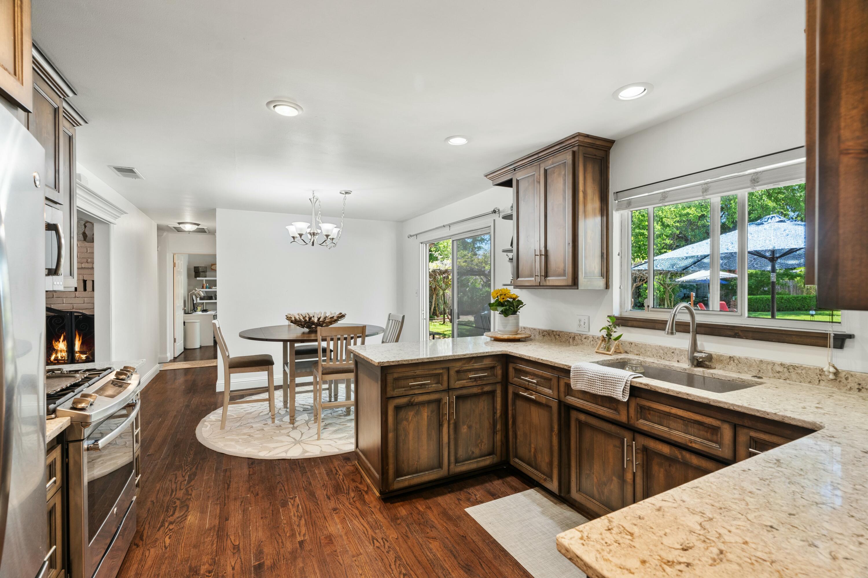 6860 Riata Drive Redding, CA 96002 - Photo 20 of 39 a kitchen with lots of counter top space a sink appliances and cabinets