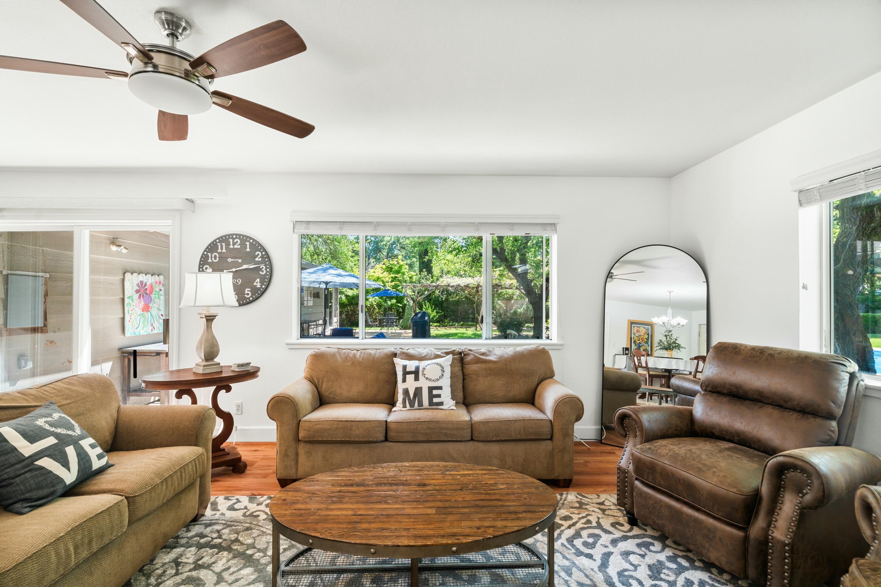 6860 Riata Drive Redding, CA 96002 - Photo 25 of 39 a living room with furniture and a large window