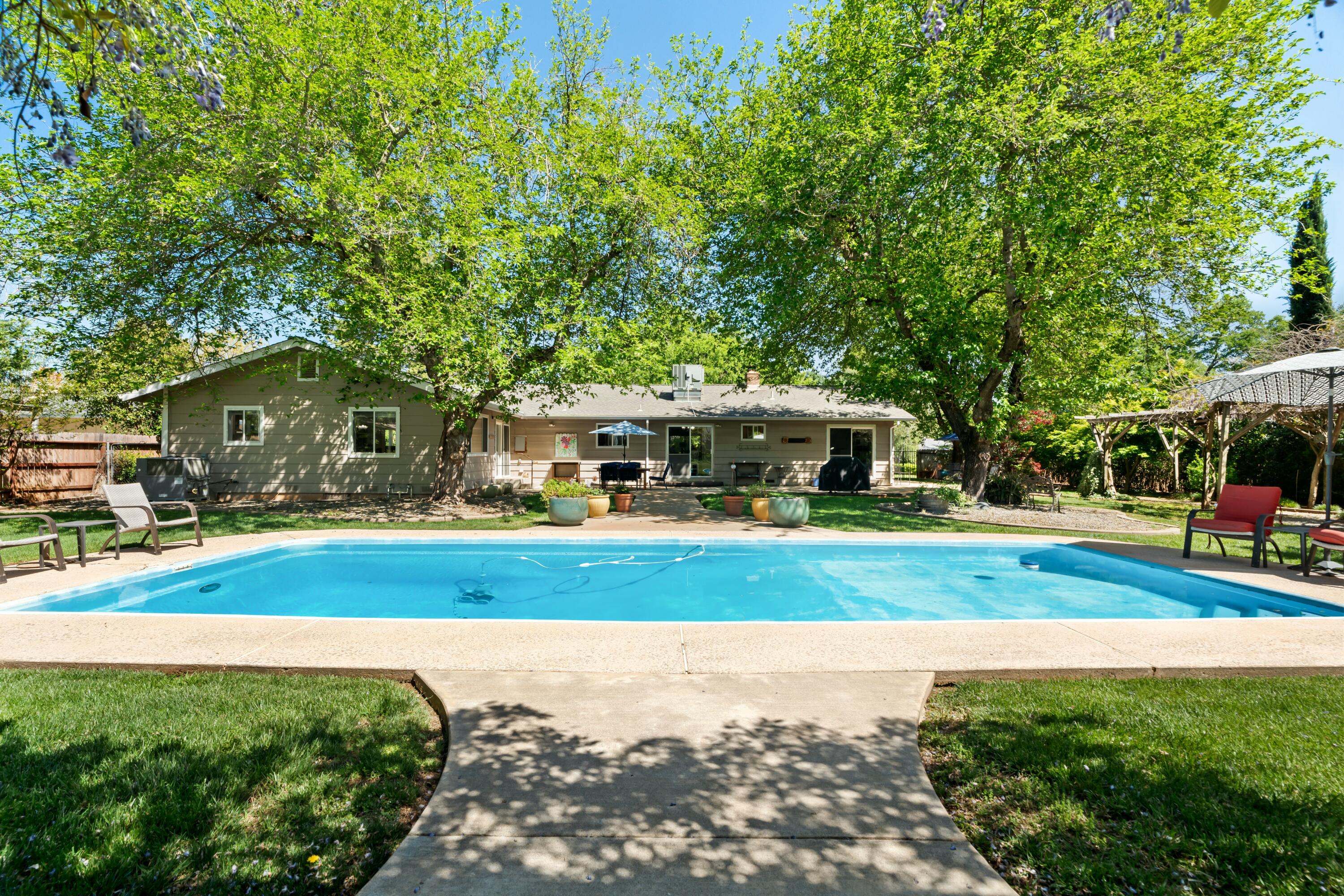 6860 Riata Drive Redding, CA 96002 - Photo 29 of 39 a front view of house with yard and green space