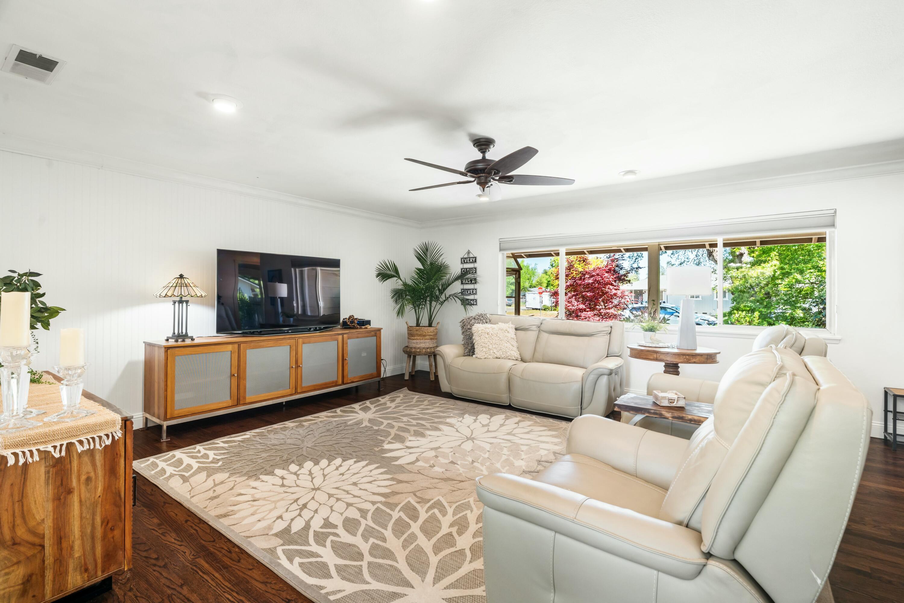 6860 Riata Drive Redding, CA 96002 - Photo 6 of 39 a living room with furniture and a flat screen tv