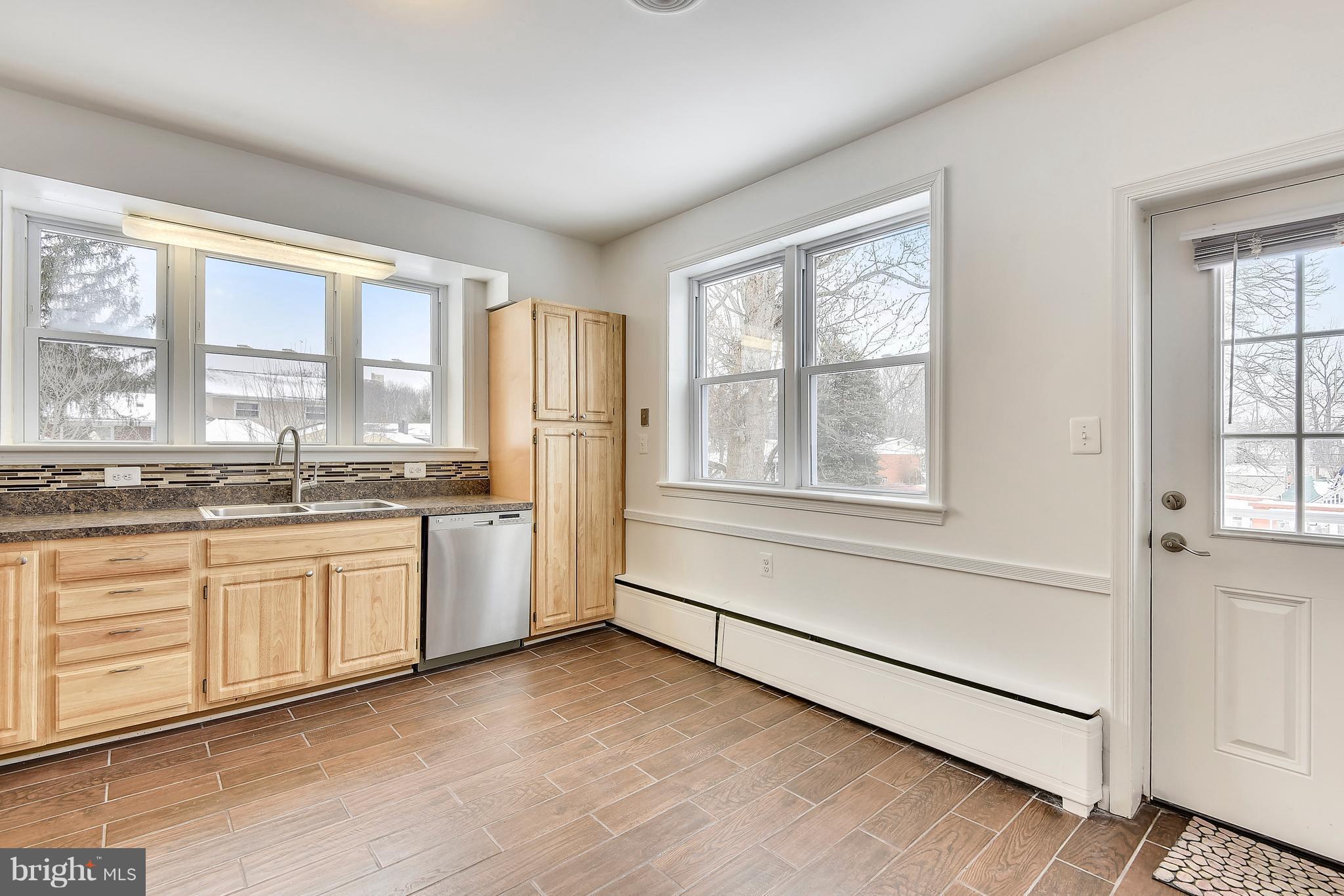 911 Gabel Street Silver Spring, MD 20901 - Photo 7 of 26 Kitchen w/ lots of windows and walkout to deck.