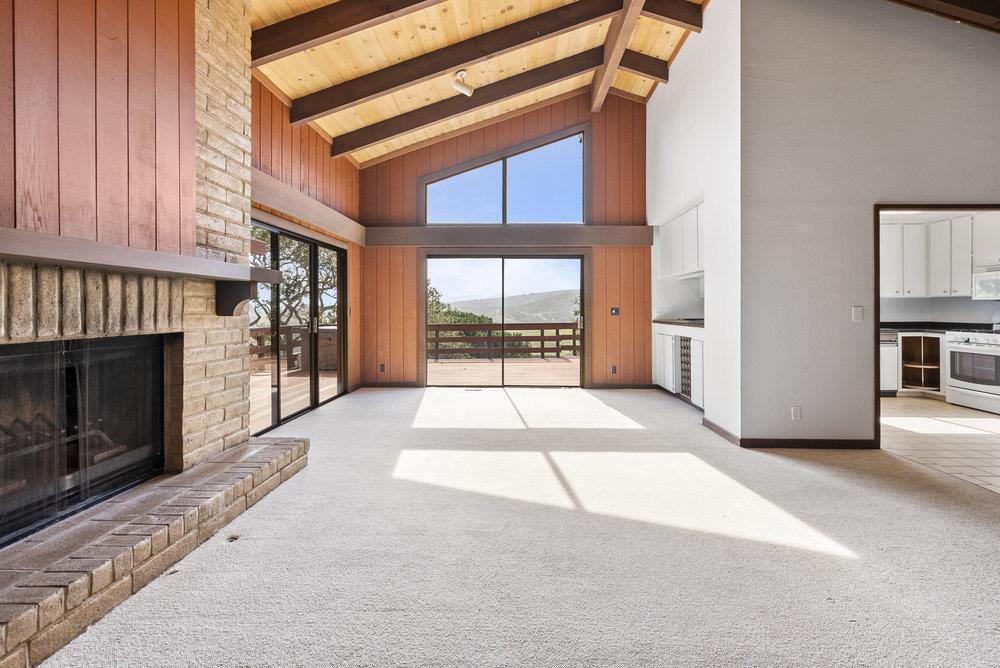 14104 Reservation Road Salinas, CA 93908 - Photo 15 of 56 a view of a room with a fireplace and windows