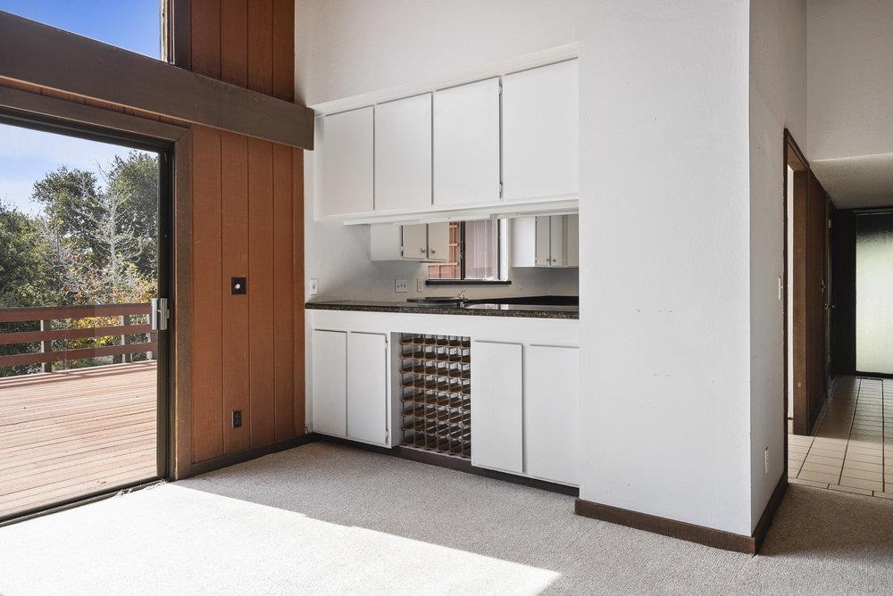 14104 Reservation Road Salinas, CA 93908 - Photo 19 of 56 a kitchen with white cabinets and window