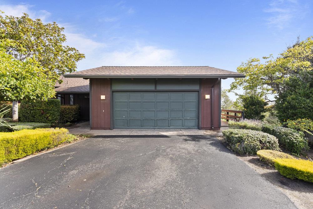 14104 Reservation Road Salinas, CA 93908 - Photo 3 of 56 a front view of a house with a yard and garage
