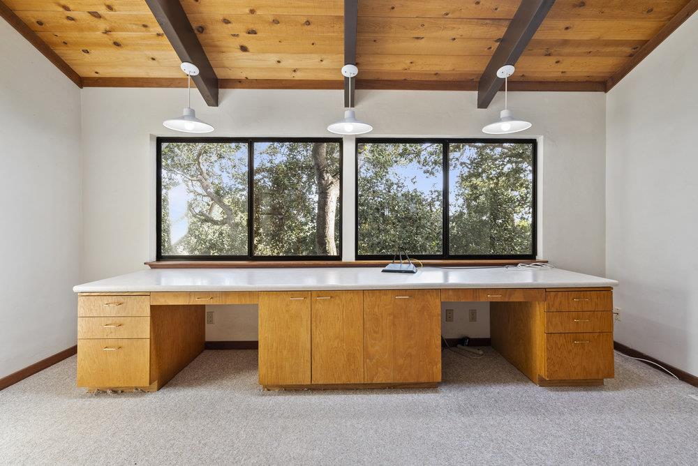 14104 Reservation Road Salinas, CA 93908 - Photo 32 of 56 a room with wooden floor and a ceiling fan