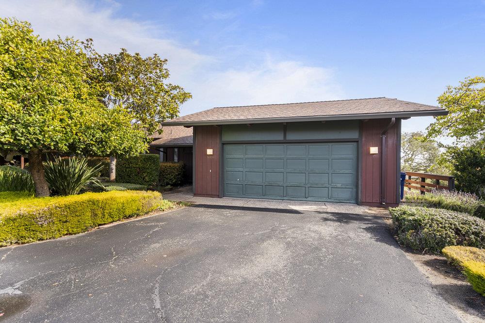 14104 Reservation Road Salinas, CA 93908 - Photo 4 of 56 a front view of a house with a yard and garage
