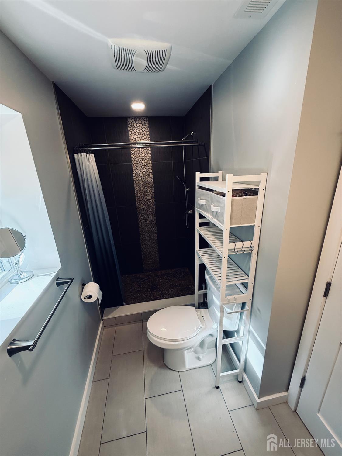 566 Ticetown Road Old Bridge, NJ 08857 - Photo 12 of 23 a bathroom with a toilet and a shower