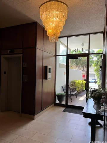 a view of hallway with a large mirror and a shower