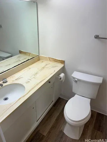 a bathroom with a toilet and a bath tub