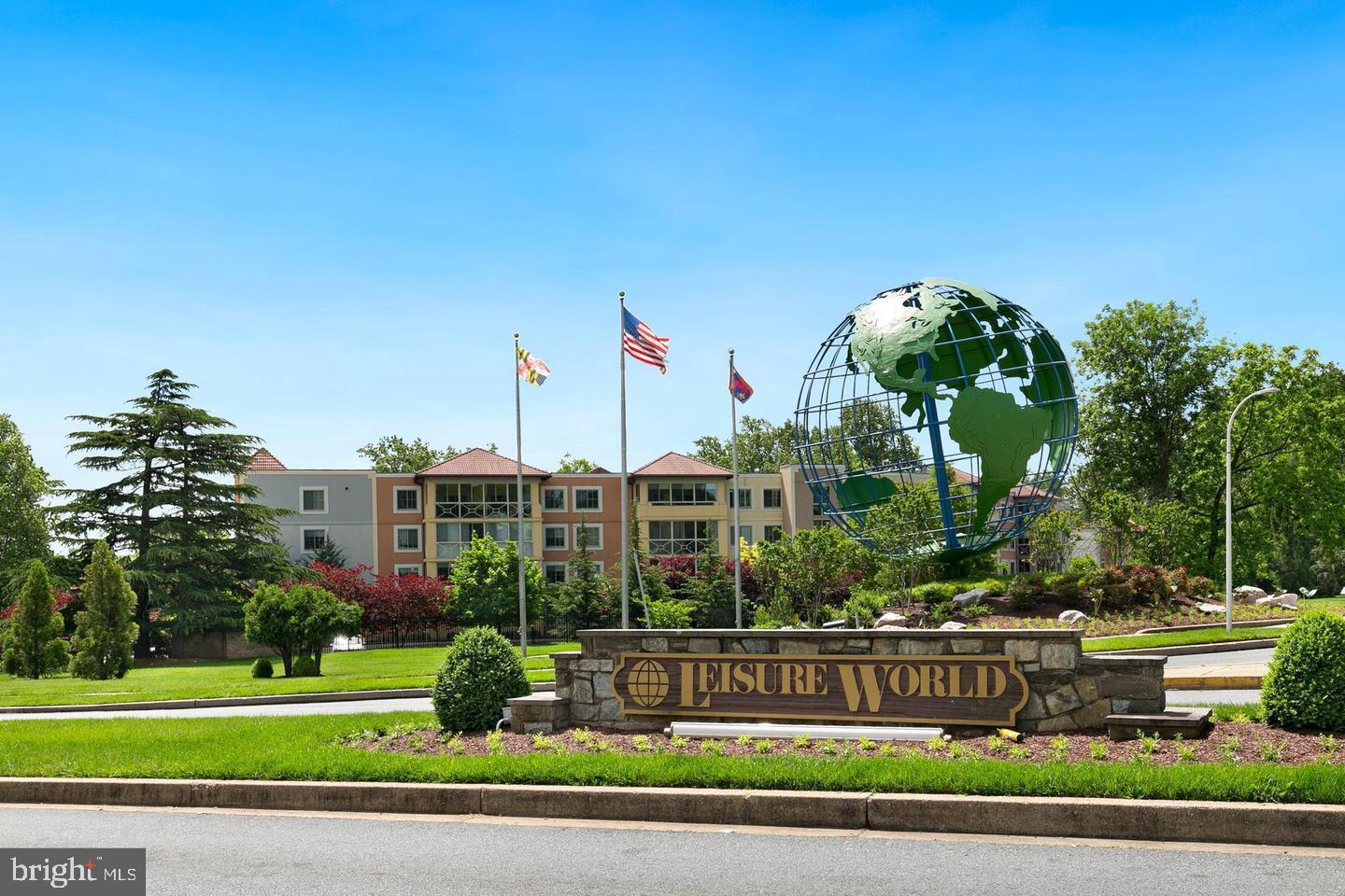 15107 Interlachen Drive, Unit 2815 Silver Spring, MD 20906 - Photo 16 of 35 a front view of multi story residential apartment building with yard and green space