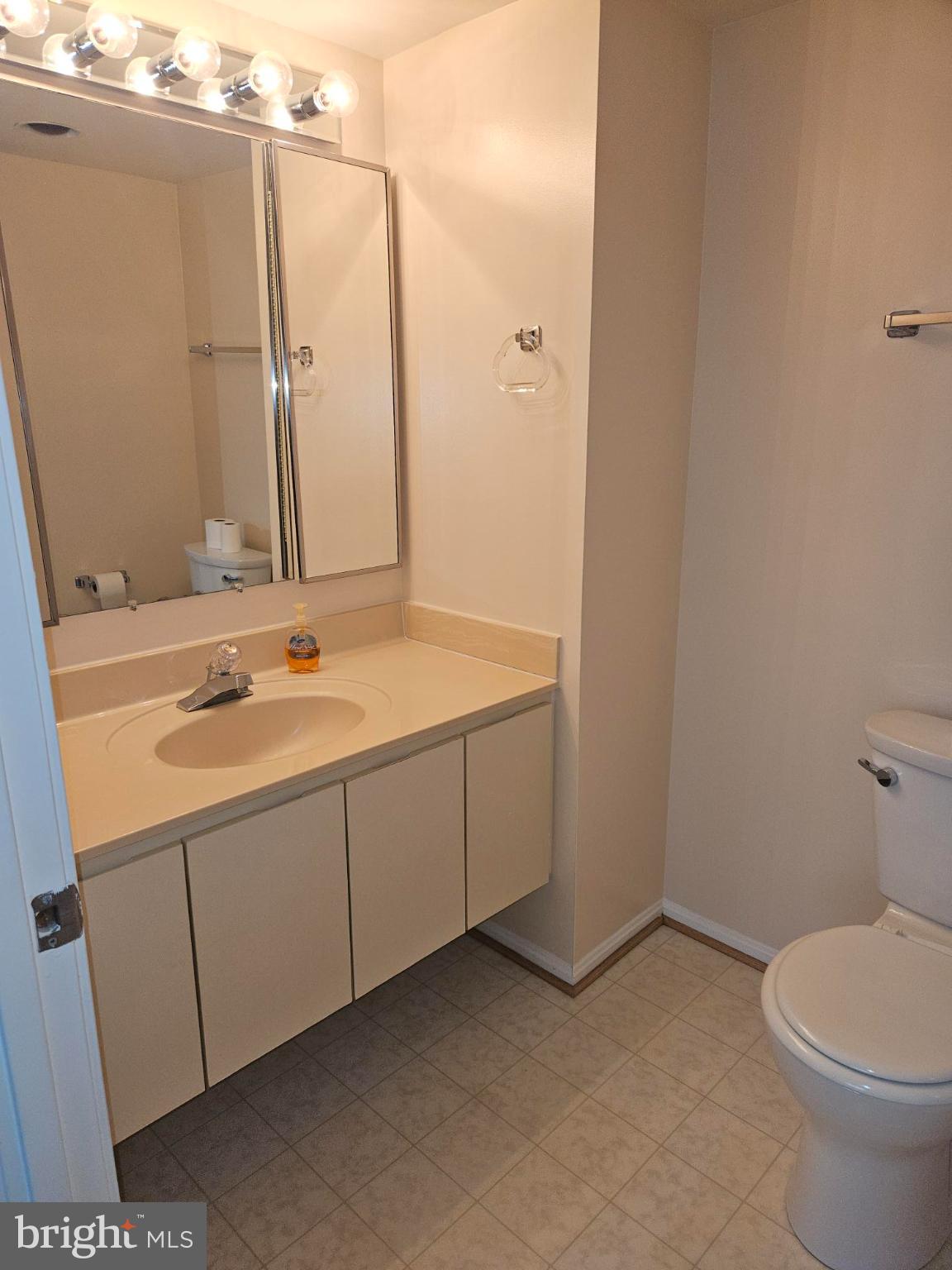 15107 Interlachen Drive, Unit 2815 Silver Spring, MD 20906 - Photo 28 of 35 a bathroom with a sink and a toilet