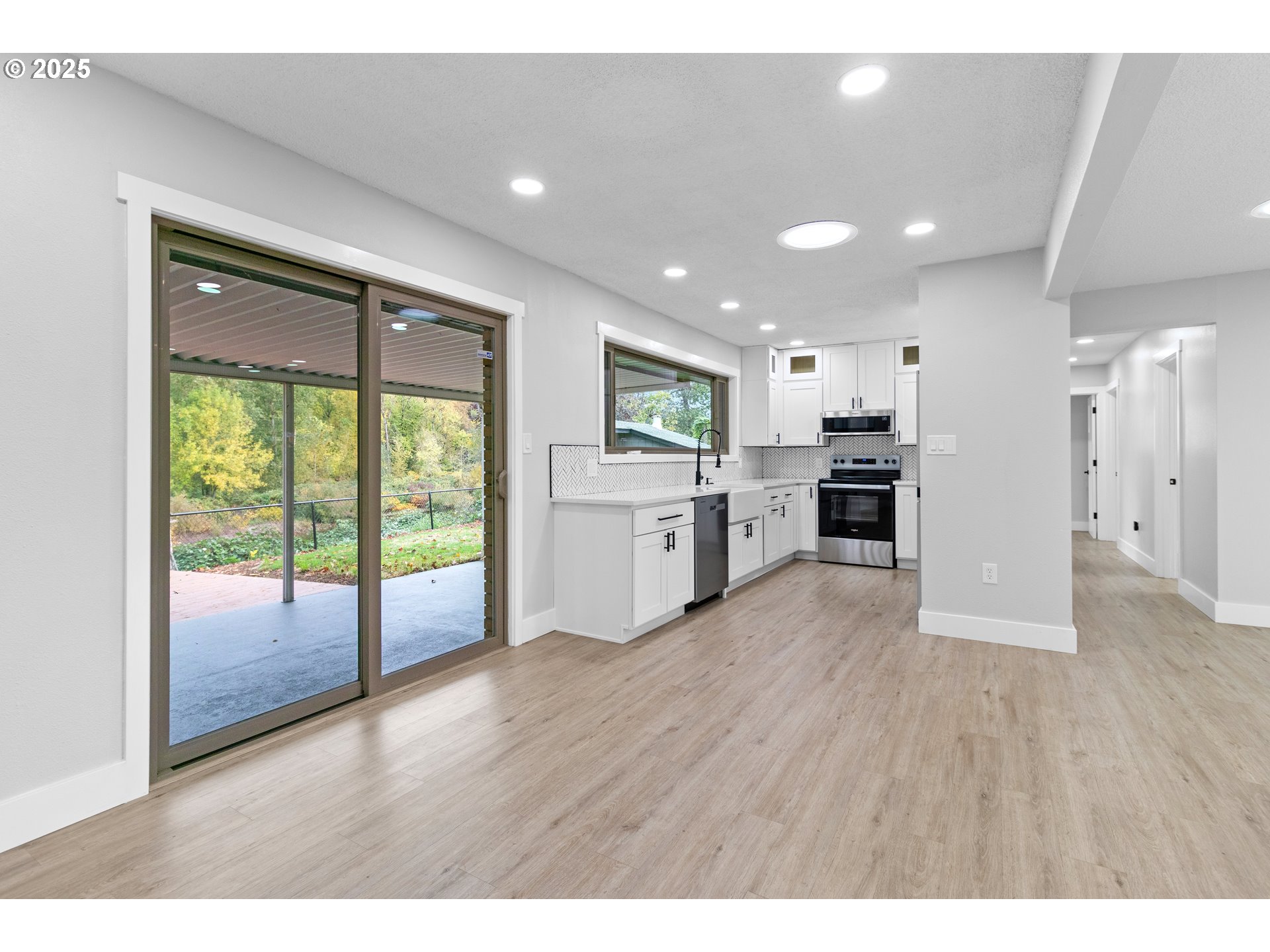 2859 Northeast 2nd Avenue Camas, WA 98607 - Photo 11 of 48 a view of a kitchen with a refrigerator and a stove top oven