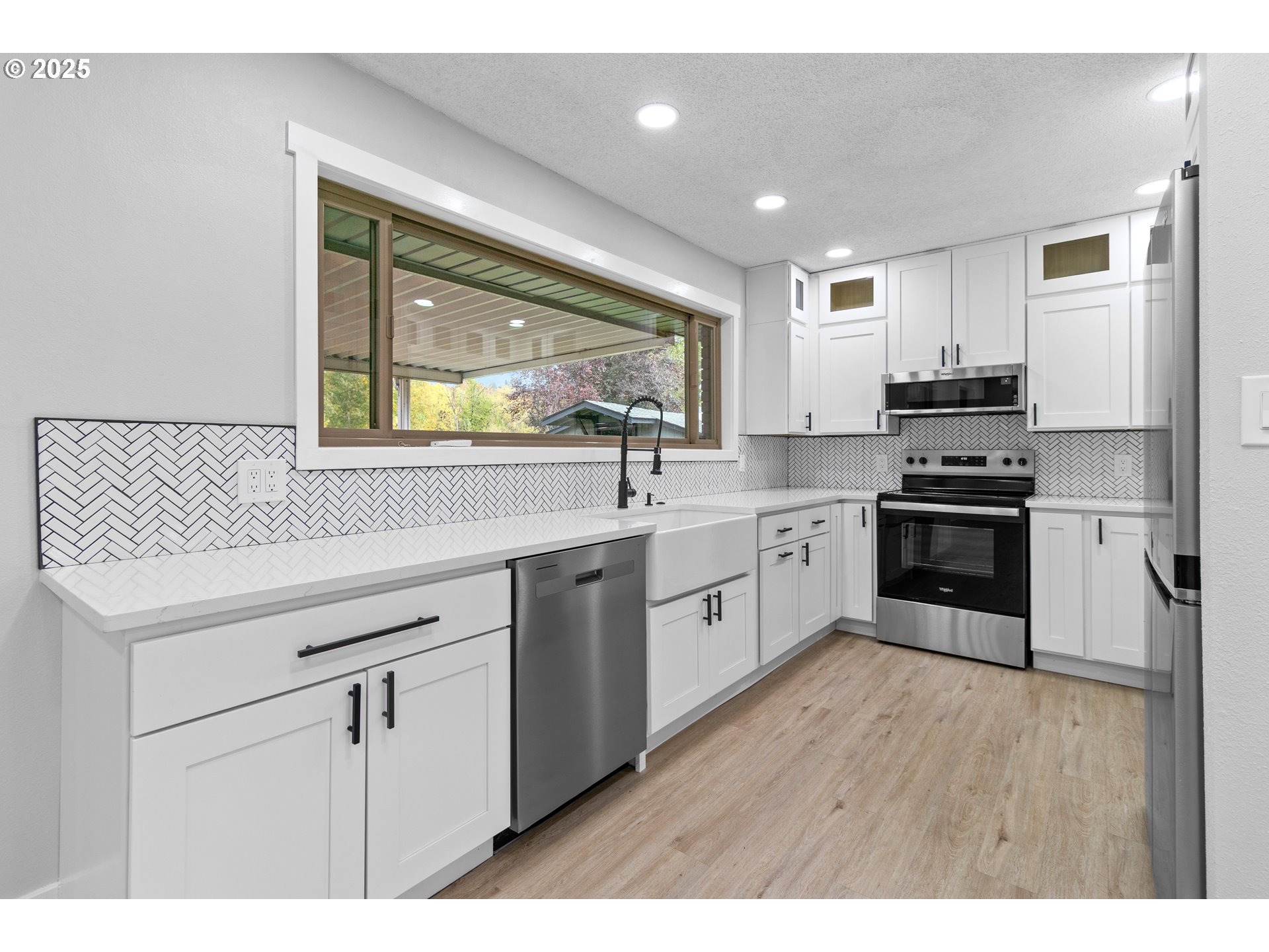 2859 Northeast 2nd Avenue Camas, WA 98607 - Photo 14 of 48 a kitchen with stainless steel appliances granite countertop a sink and cabinets