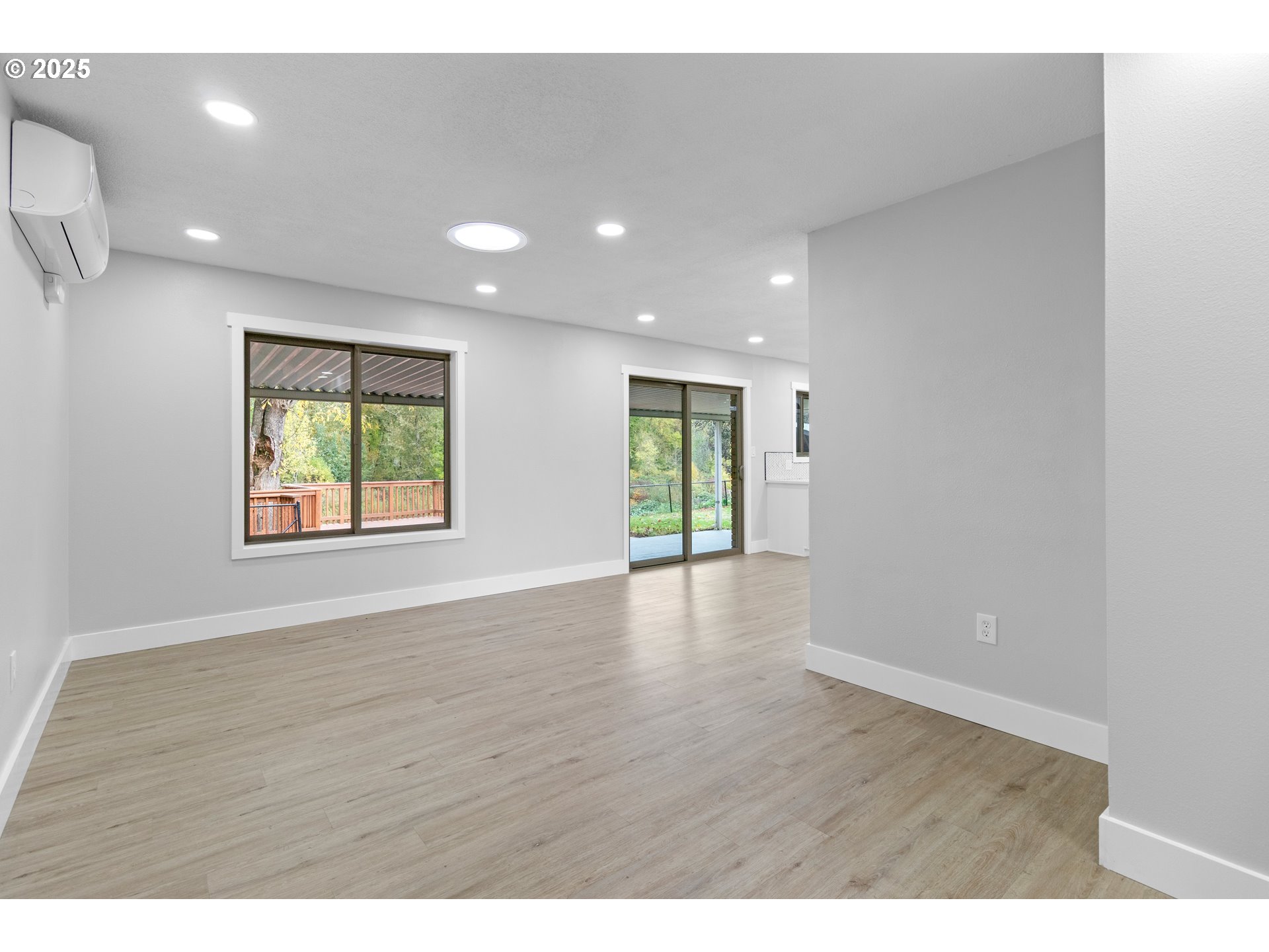 2859 Northeast 2nd Avenue Camas, WA 98607 - Photo 20 of 48 a view of an empty room with wooden floor and a window