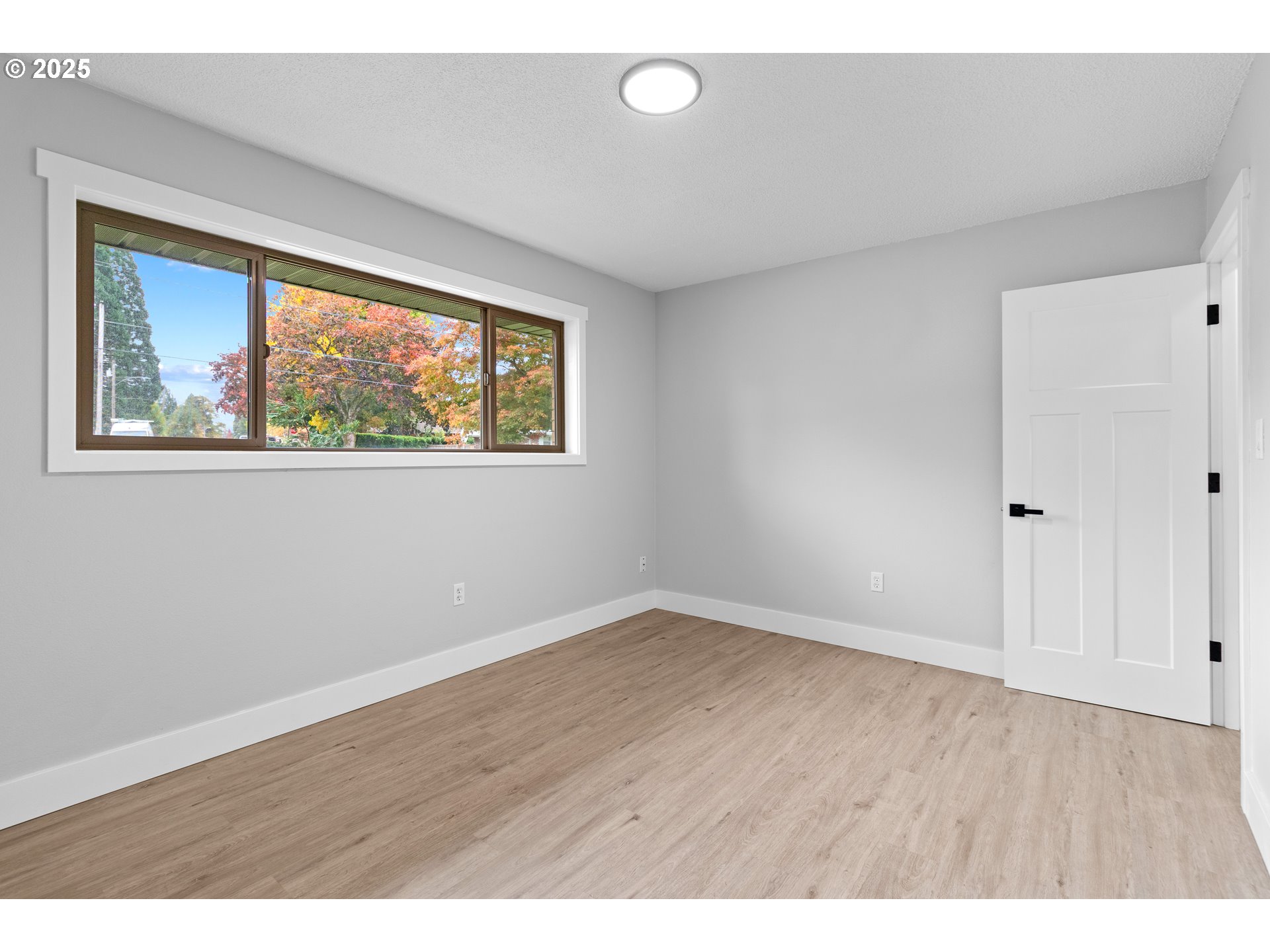 2859 Northeast 2nd Avenue Camas, WA 98607 - Photo 24 of 48 an empty room with wooden floor and windows