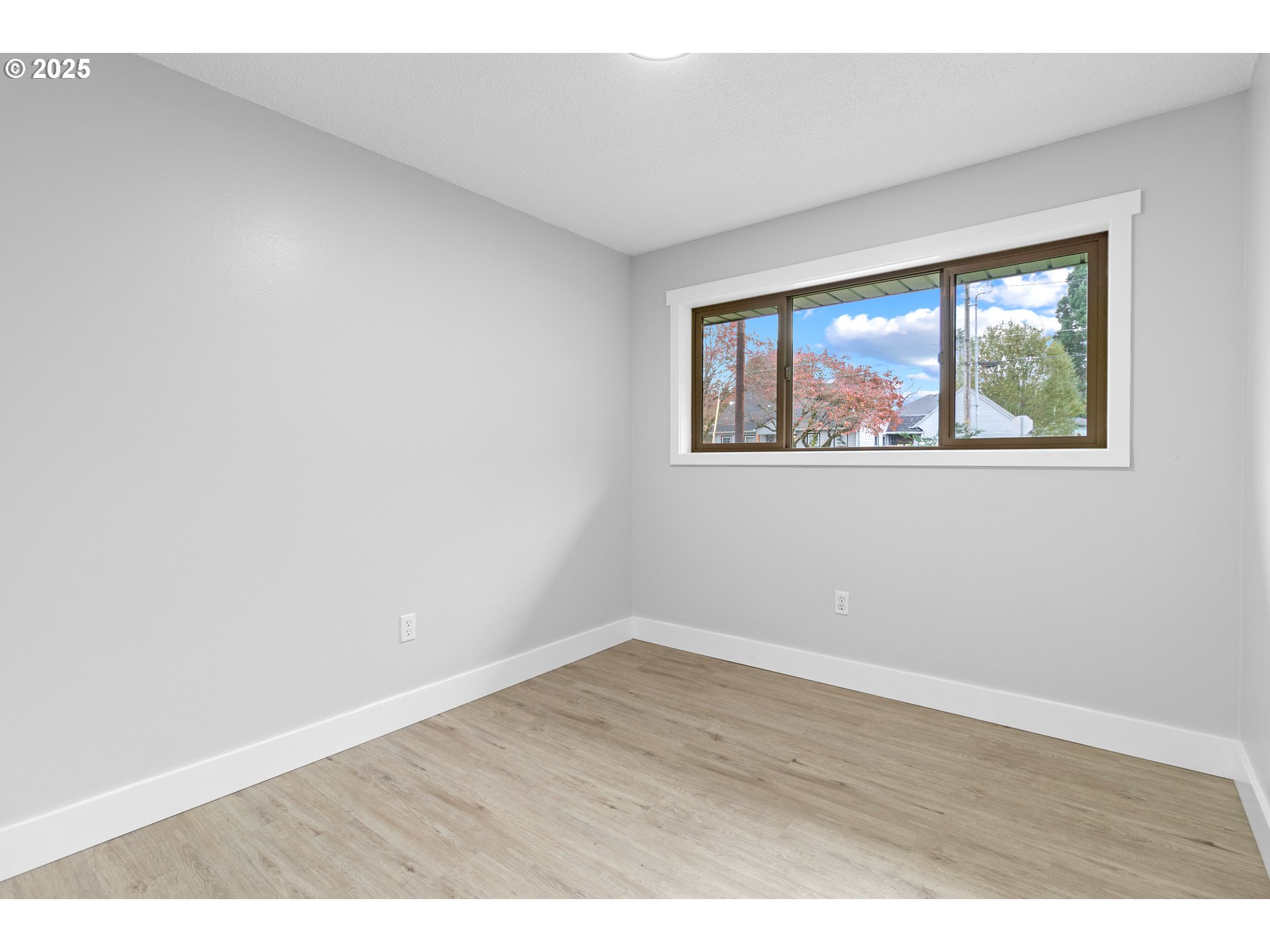 2859 Northeast 2nd Avenue Camas, WA 98607 - Photo 26 of 48 an empty room with wooden floor and windows