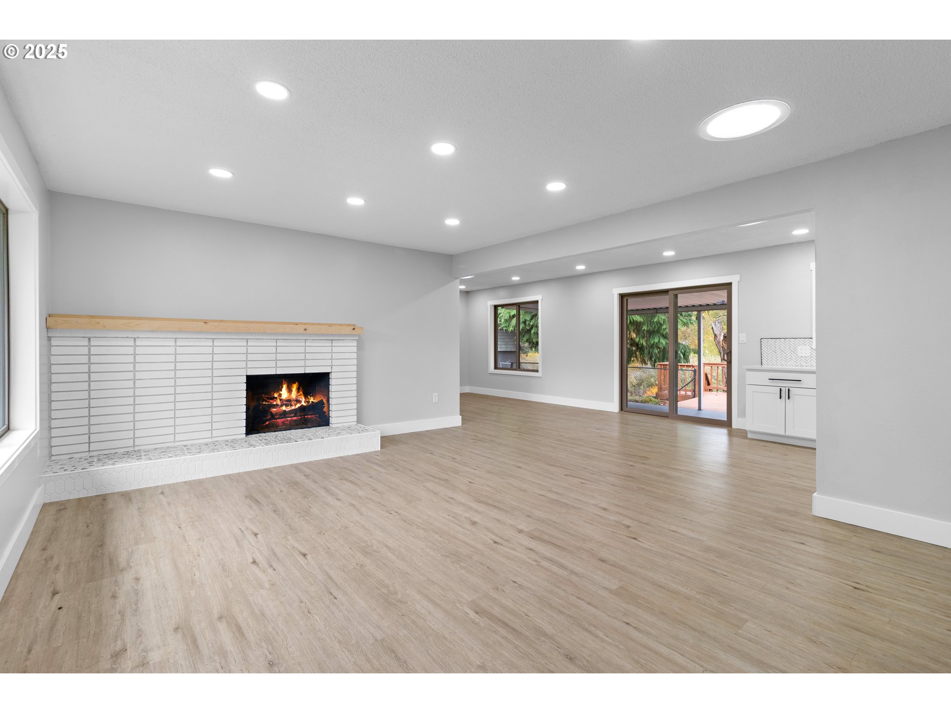 2859 Northeast 2nd Avenue Camas, WA 98607 - Photo 5 of 48 a view of an empty room with a fireplace and a window