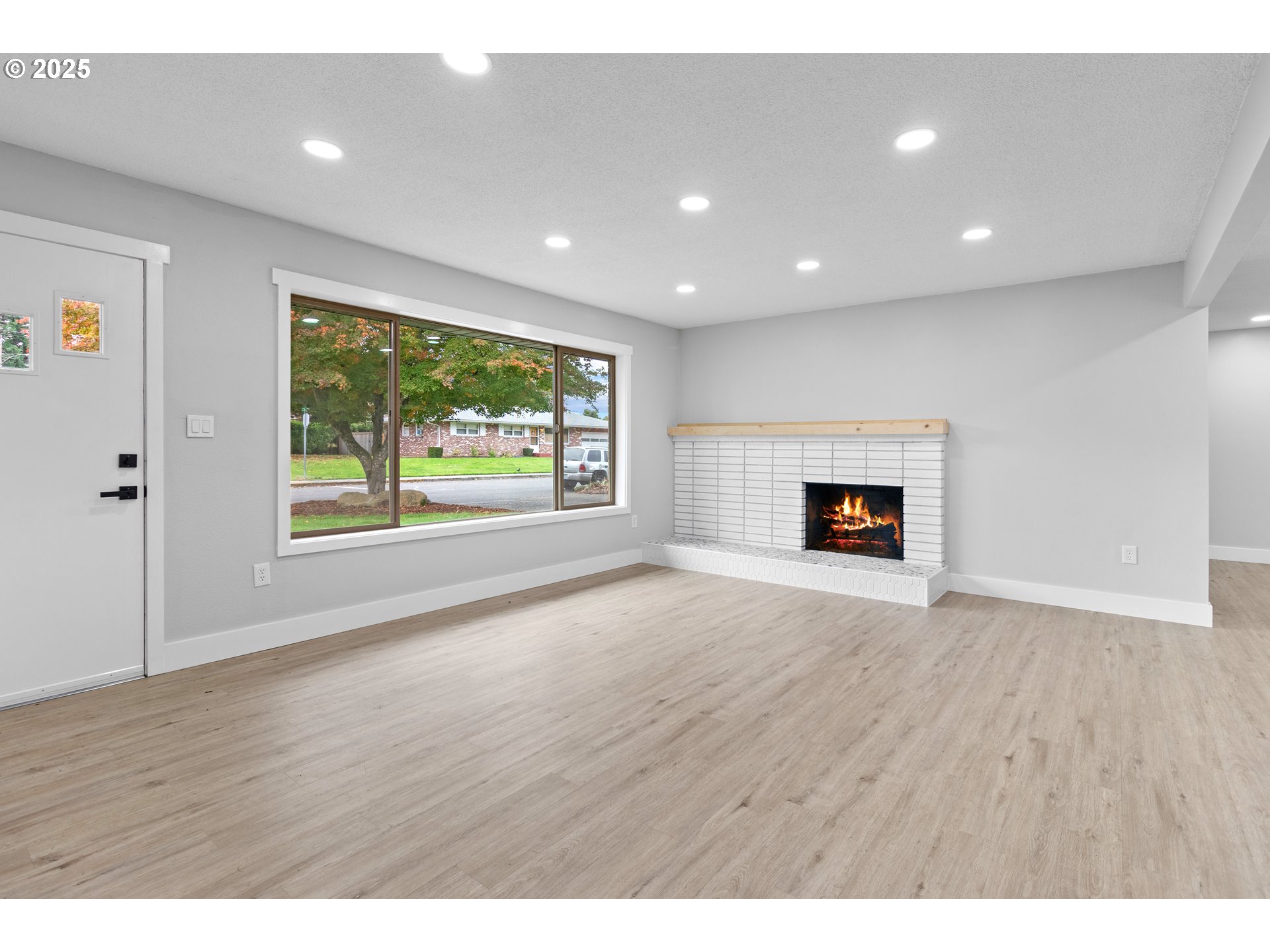 2859 Northeast 2nd Avenue Camas, WA 98607 - Photo 7 of 48 a view of empty room with wooden floor and fireplace