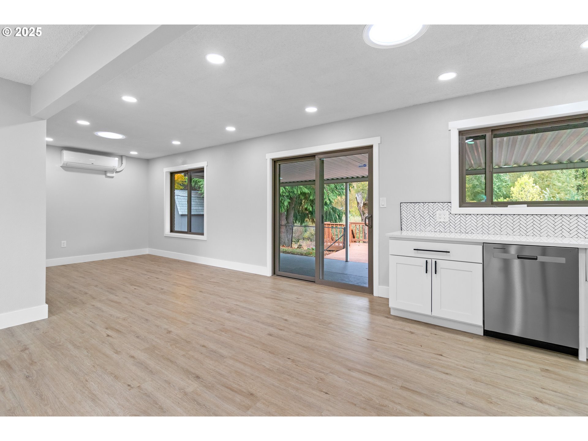 2859 Northeast 2nd Avenue Camas, WA 98607 - Photo 10 of 48 a view of a kitchen with a sink and dishwasher with wooden floor