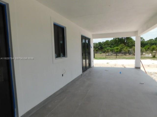 160 North Isora Street Clewiston, FL 33440 - Photo 13 of 26 a view of empty room with floor to ceiling window