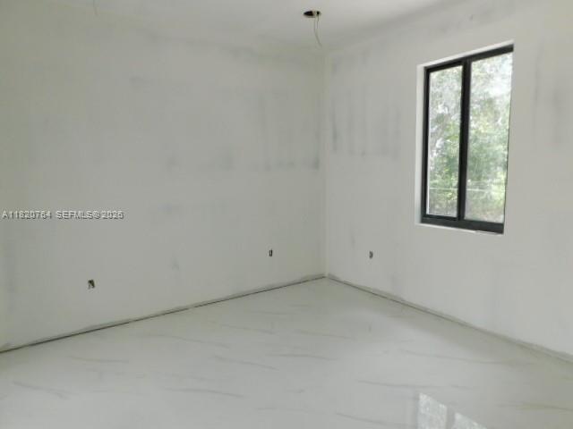 160 North Isora Street Clewiston, FL 33440 - Photo 9 of 26 a view of an empty room with a window