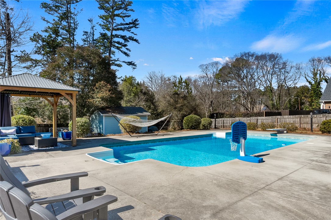 112 C-10-220 Anderson, SC 29621 - Photo 42 of 45 This spacious yard features a refreshing pool, perfect for outdoor enjoyment and relaxation.