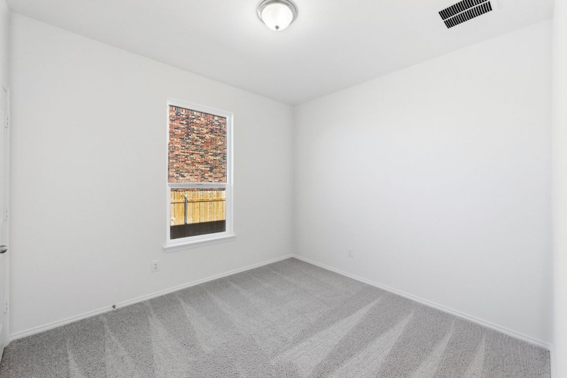 Undisclosed Address Manor, TX 78653 - Photo 24 of 31 a view of an empty room with a window